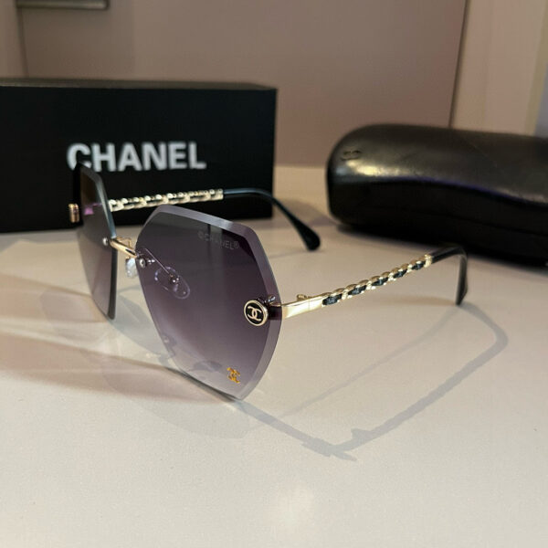 Oversized Rimless Sunglasses with Chain Temples · Chanel-Inspired Design